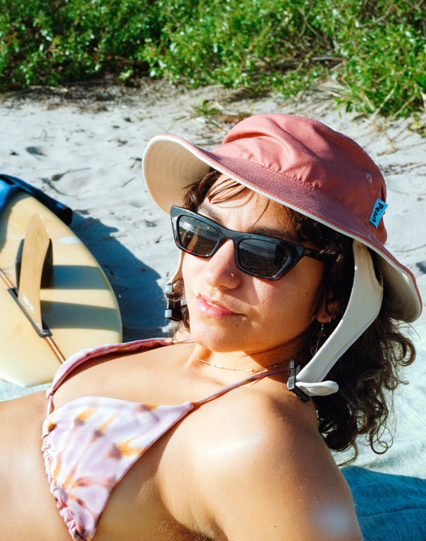 red and sand color surf hat
