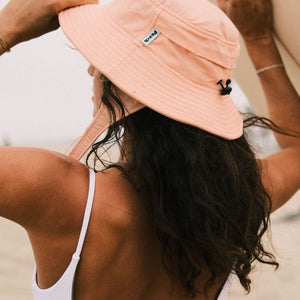 peach color surf hat for sun protection. boonie hat for water sports