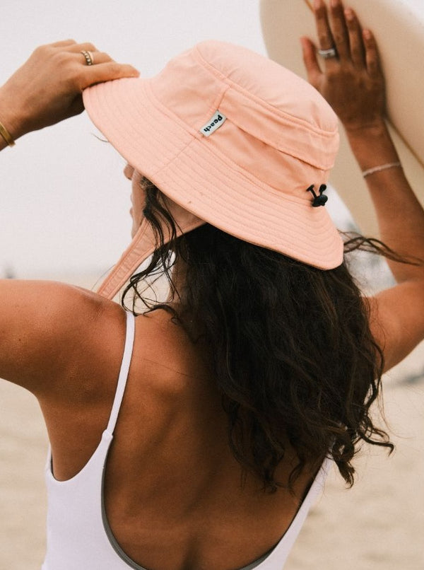 peach color surf hat for sun protection. boonie hat for water sports