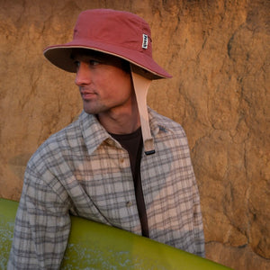 red bucket hat with chin strap