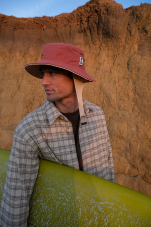 red bucket hat with chin strap