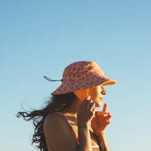 yellow and pink floral surf hat